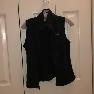 black Patagonia vest with two zip up pockets